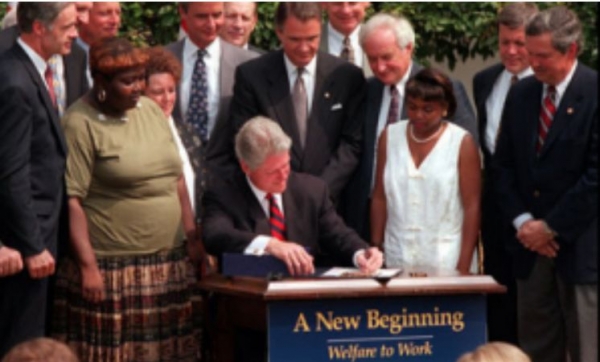 Lillie Harden (left) at the signing ceremony of President Bill Clinton’s welfare reform bill.