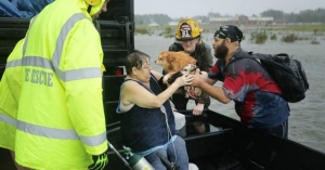 An emergency crew rescues a woman and her dog from their flooded home during Hurricane Florence Sept. 14, 2018 in James City, North Carolina. 