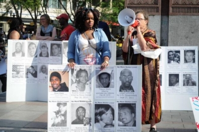 Protesters at Westlake Park last weekend displayed the photos and names of citizens killed by law enforcement.