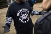 A shirt worn by a man during a rally displays a poisonous logo alongside the text &#039;City of Flint MI Water Dept.&#039; on January 24, 2016 at Flint City Hall. 