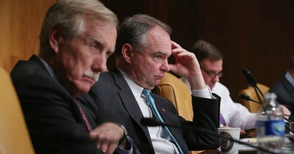 Senate Budget Committee members Sen. Angus King (I-Maine) and Sen. Tim Kaine (D-Va.) listen to testimony from Congressional Budget Office Director Keith Hall during a hearing in the Dirksen Senate Office Building on Capitol Hill. 