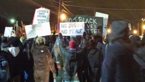 Protesters in Ferguson, Mo., on Nov. 25, 2014, respond to the St. Louis County grand jury decision not to indict Police Officer Darren Wilson in the killing of Michael Brown.  