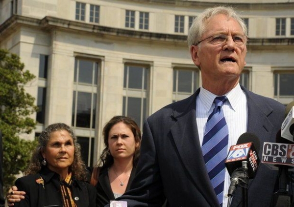 Former Gov. Don Siegelman speaks in front of the courthouse after his resentencing on Aug. 3, 2012 in Montgomery, Ala. His wife Lori and daughter Dana stand behind him. 
